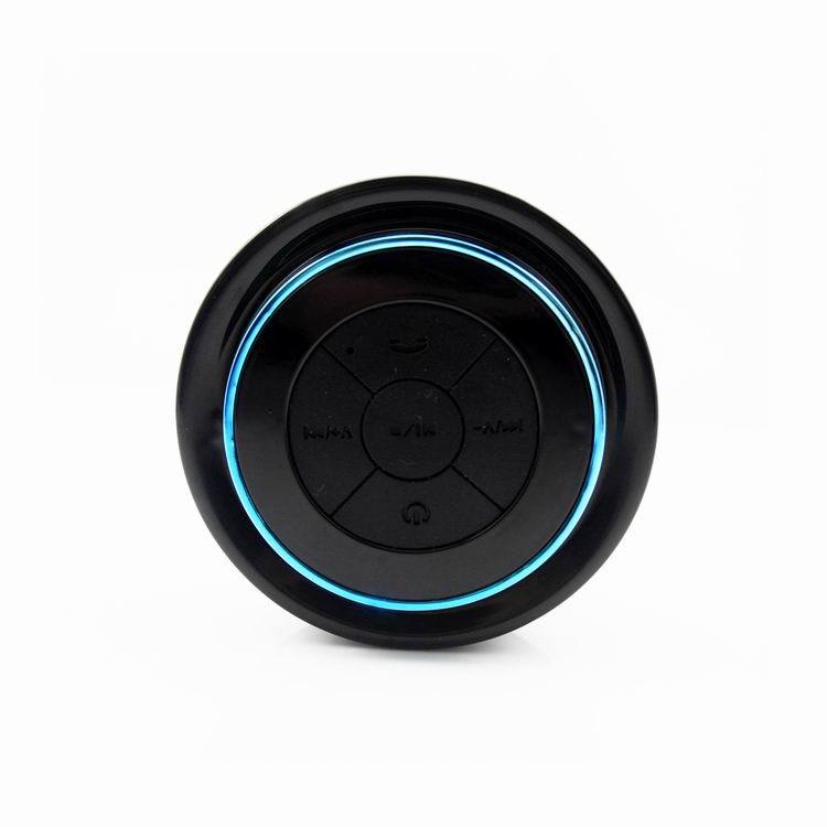 Close-up view of Waterproof Bluetooth Speaker controls with illuminated accents, designed for portable use.