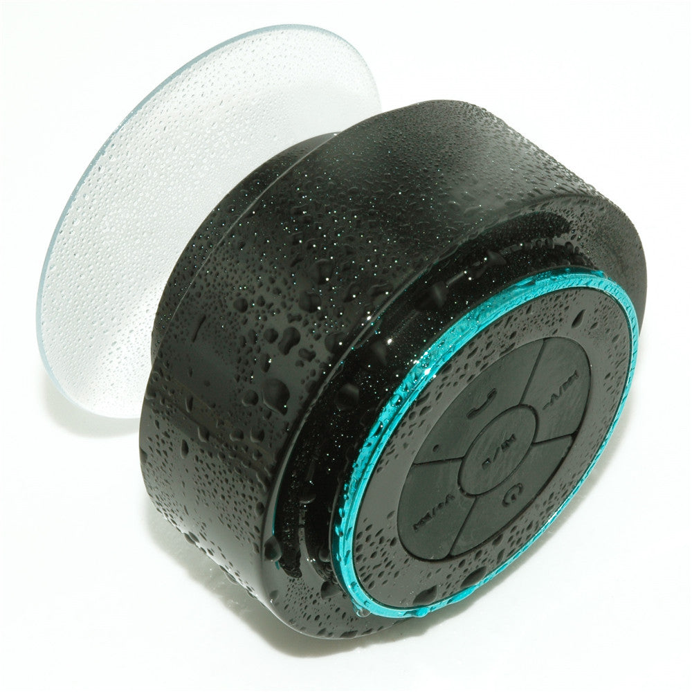 Waterproof Bluetooth Speaker mini bathroom speaker with suction cup and droplets on surface.
